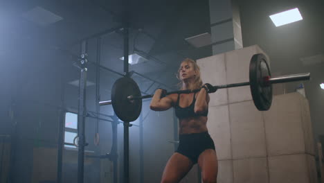 Athletic-Beautiful-Woman-Does-Overhead-Deadlift-with-a-Slow-motion:-Barbell-in-the-Gym.-Gorgeous-Female-Professional-Bodybuilder-Workout-Weight-Lift-Exercises-in-the-Authentic-Fit-Training-Facility